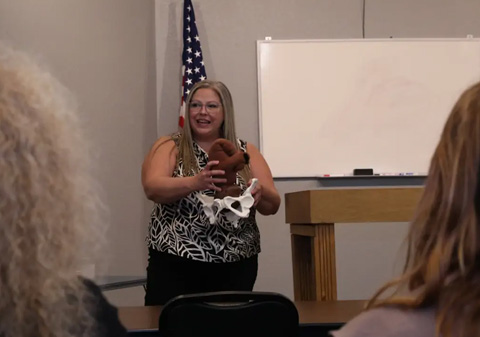 Woman Giving Lecture - Holistic Doula Program