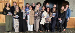 group photo of the 2025 NITE Speaks Presenters holding up the NITE Speaks Flyer